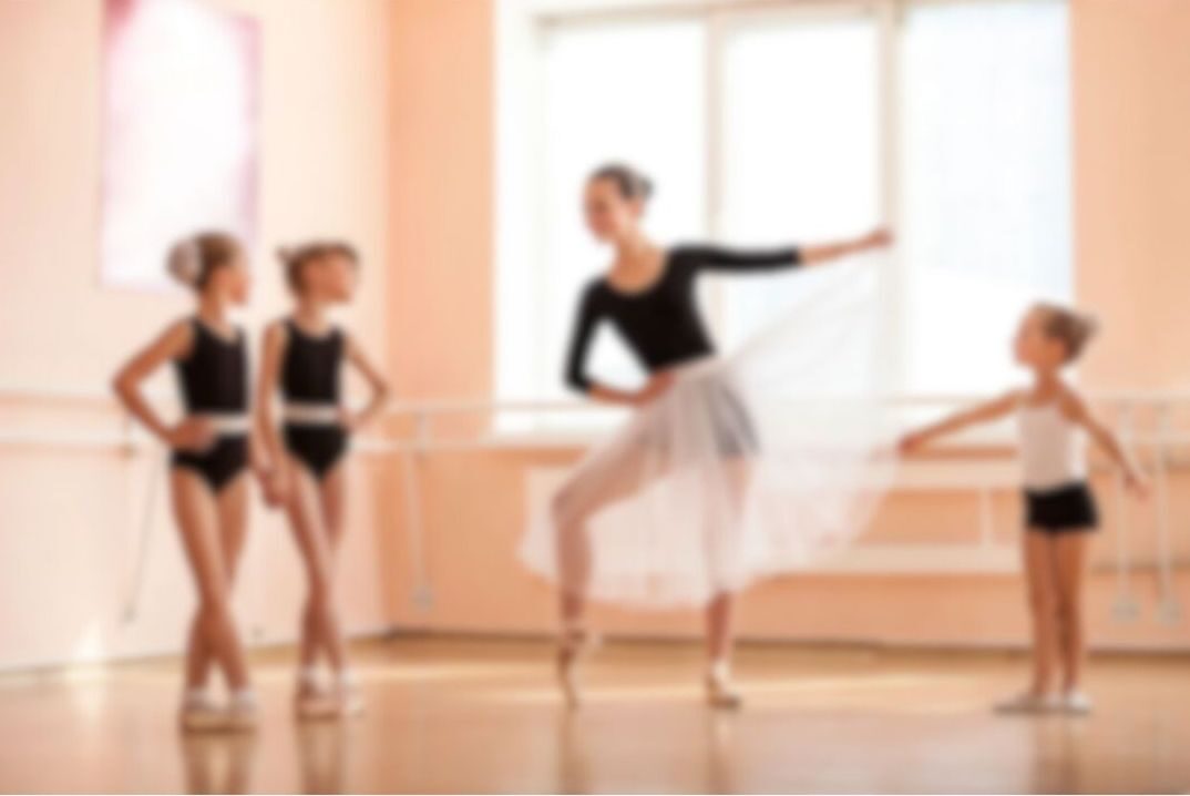 blurred background - ballet dancers at dance school