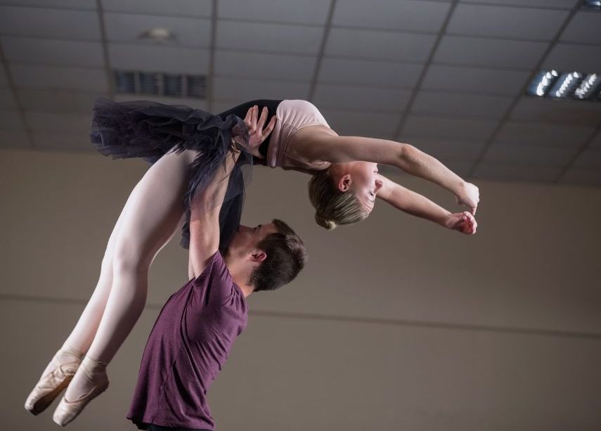 male ballet dancer lifting female partner