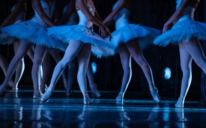 ballet dancers in costume on stage