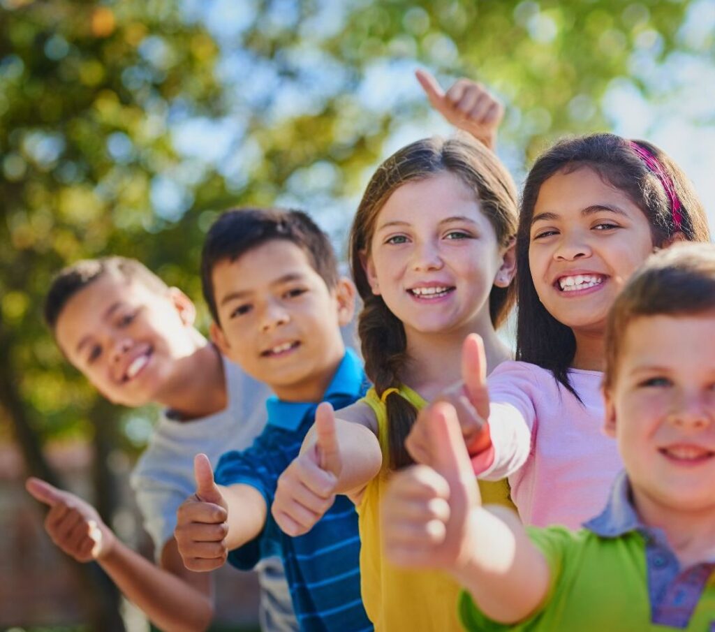 children giving thumbs up