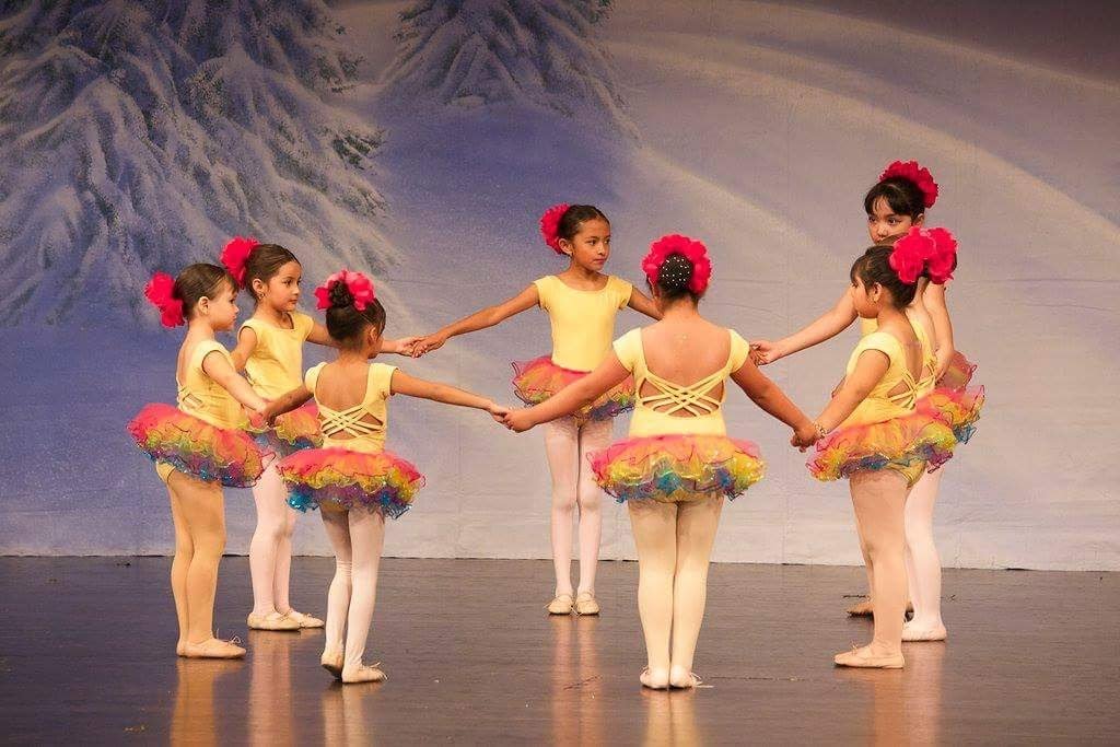 ballet students holding hands